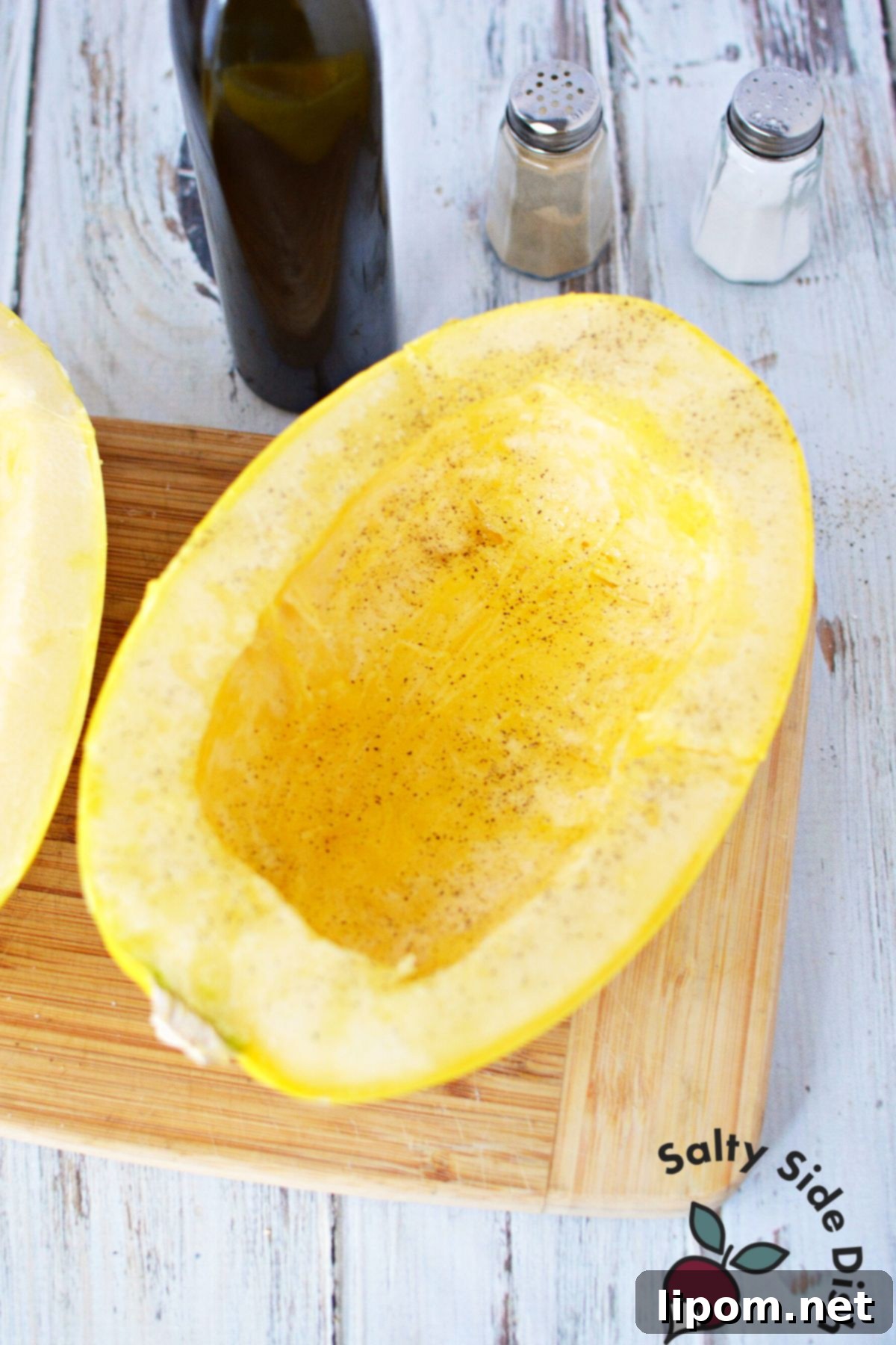 Mastering Spaghetti Squash 6 adding seasoning to squash halves.