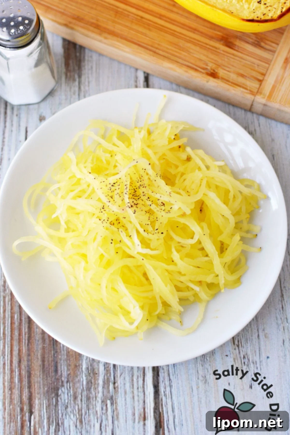 Mastering Spaghetti Squash 9 spaghetti squash strands on a plate.