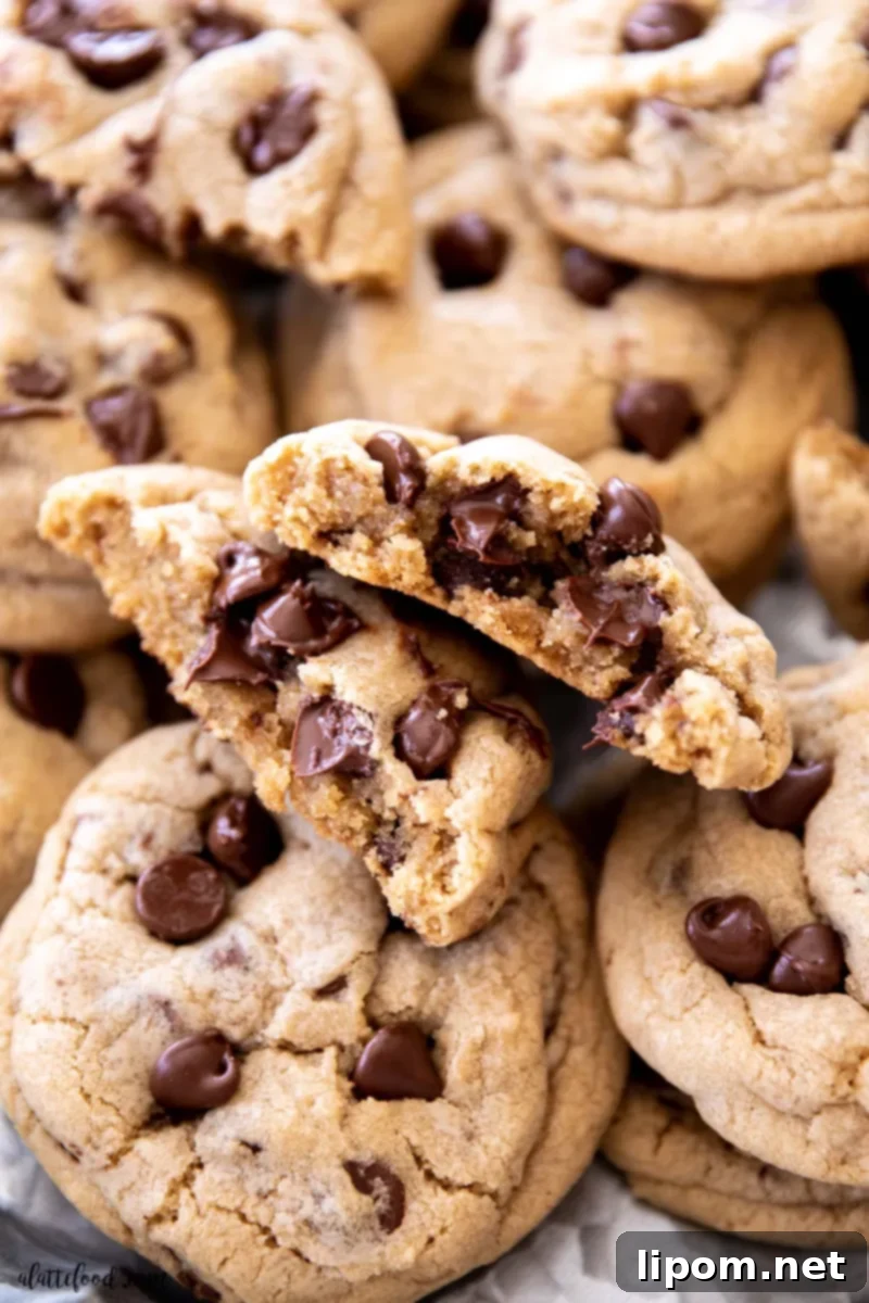 Irresistible homemade chocolate chip cookies, perfectly baked and cut in half to reveal their soft, chewy centers with melted chocolate chips. This recipe uses vanilla extract and semisweet chocolate chips for the ultimate flavor and texture.