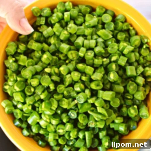 Bite-Sized Green Beans 7 diced green beans in a bowl.