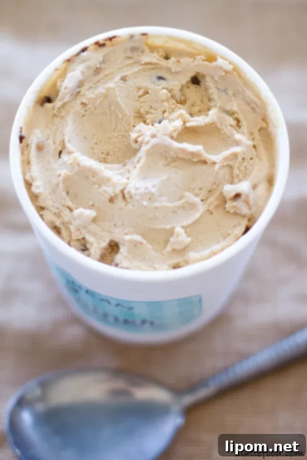 This creamy peanut butter ice cream is swirled with ribbons of chocolate, peanut butter chips, and chocolate chips. It's a chocolate peanut butter dream! | www.alattefood.com