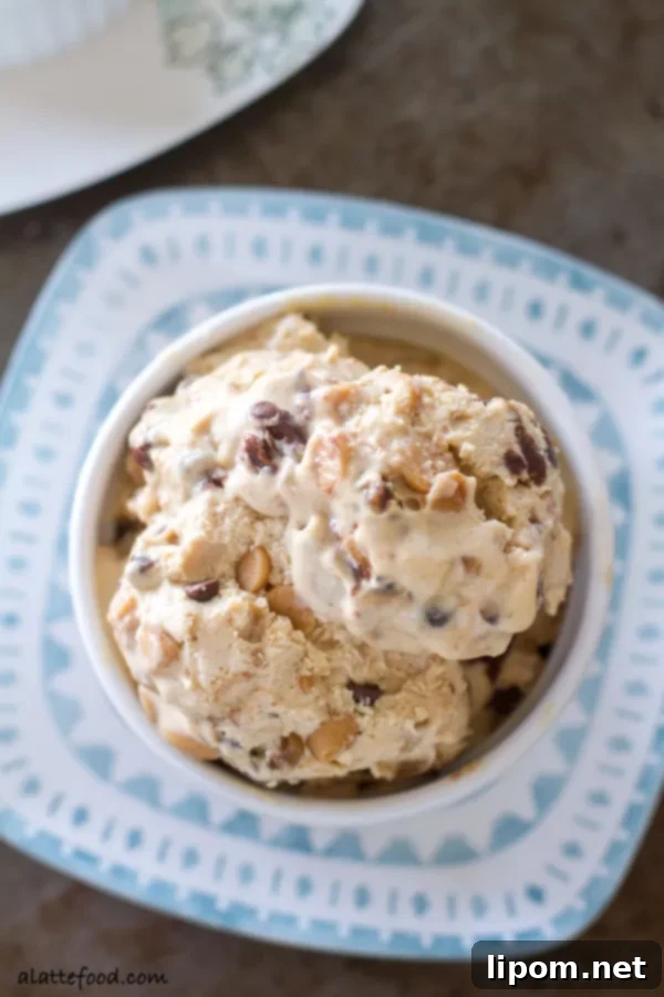 This creamy peanut butter ice cream is swirled with ribbons of chocolate, peanut butter chips, and chocolate chips. It's a chocolate peanut butter dream! | www.alattefood.com