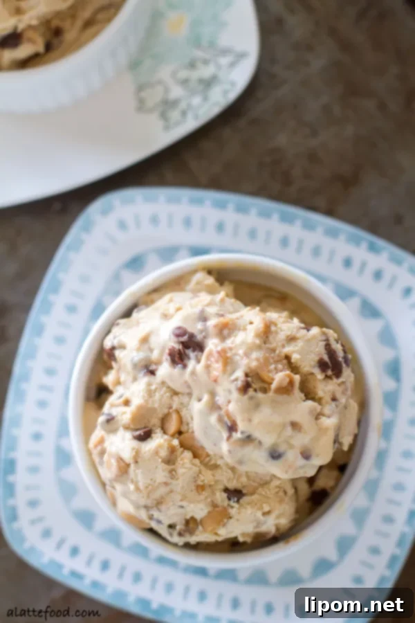 This creamy peanut butter ice cream is swirled with ribbons of chocolate, peanut butter chips, and chocolate chips. It's a chocolate peanut butter dream! | www.alattefood.com