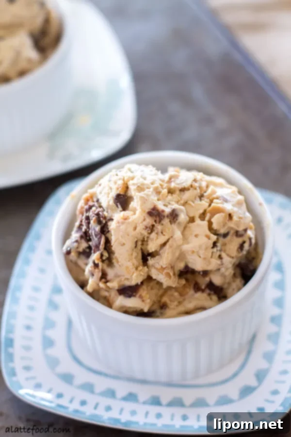 This creamy peanut butter ice cream is swirled with ribbons of chocolate, peanut butter chips, and chocolate chips. It's a chocolate peanut butter dream! | www.alattefood.com
