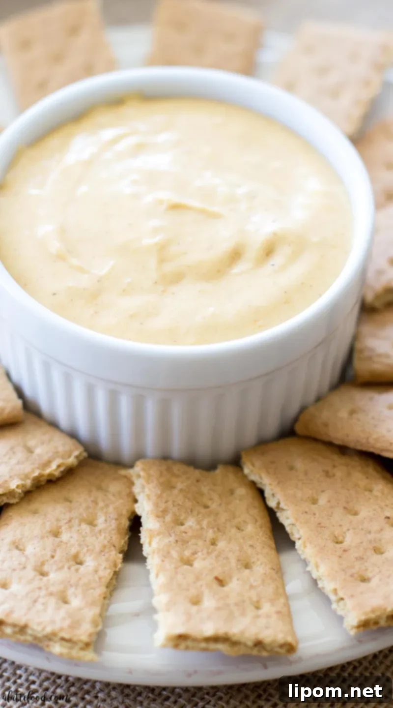 creamy pumpkin pie fluff dip in white dish