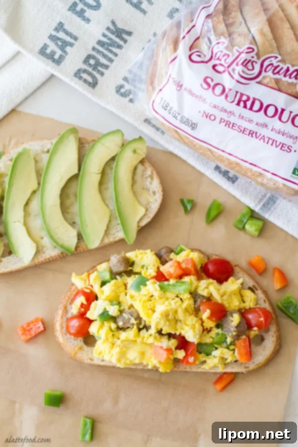 This hearty breakfast sandwich is made with San Luis Sourdough® Bread, scrambled eggs, bell peppers, pepper jack cheese, sausage, and avocado! It's an easy breakfast recipe that will stick with you all morning!