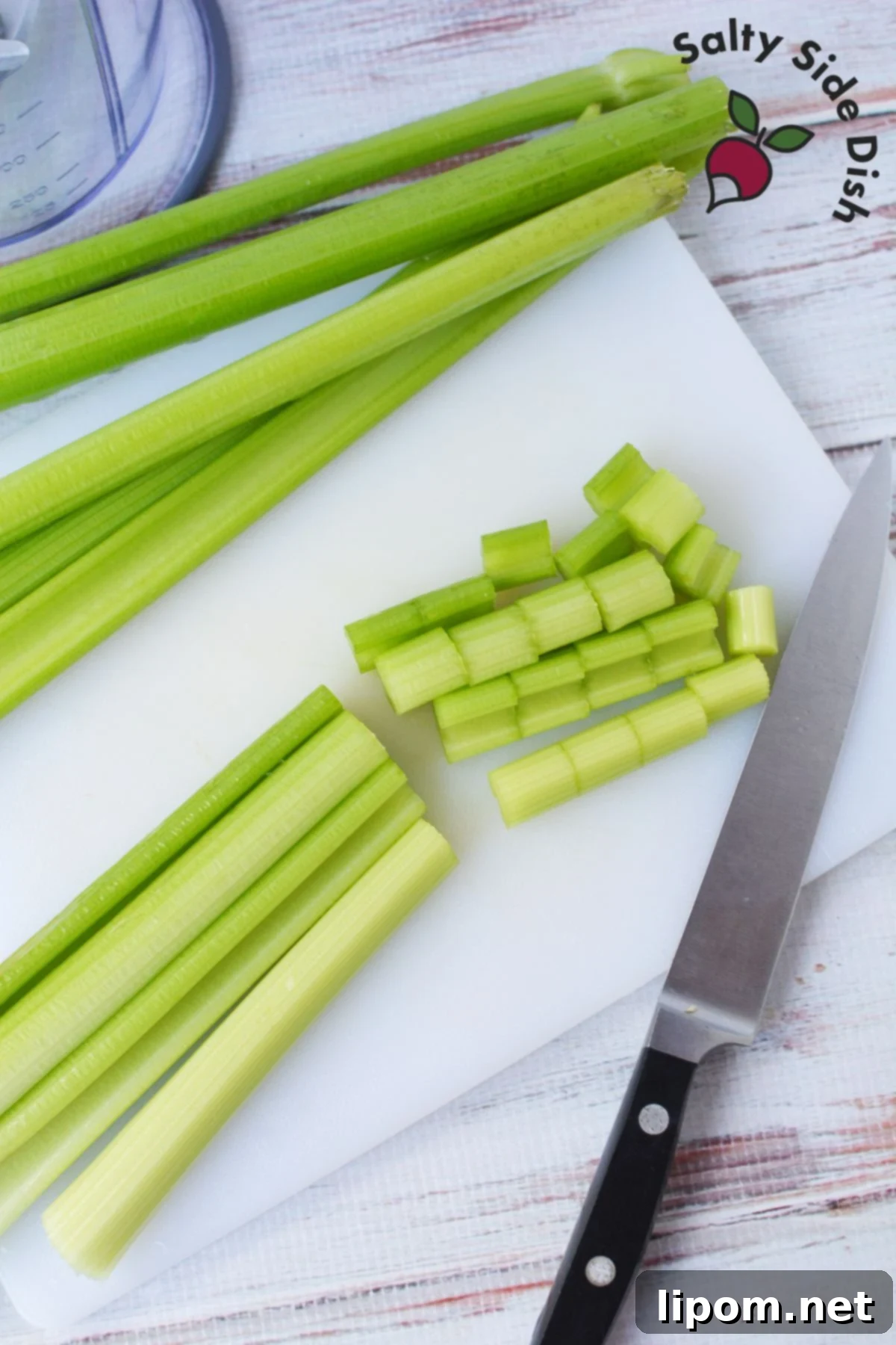 Celery Juice 3 Chopping fresh celery stalks for juicing.