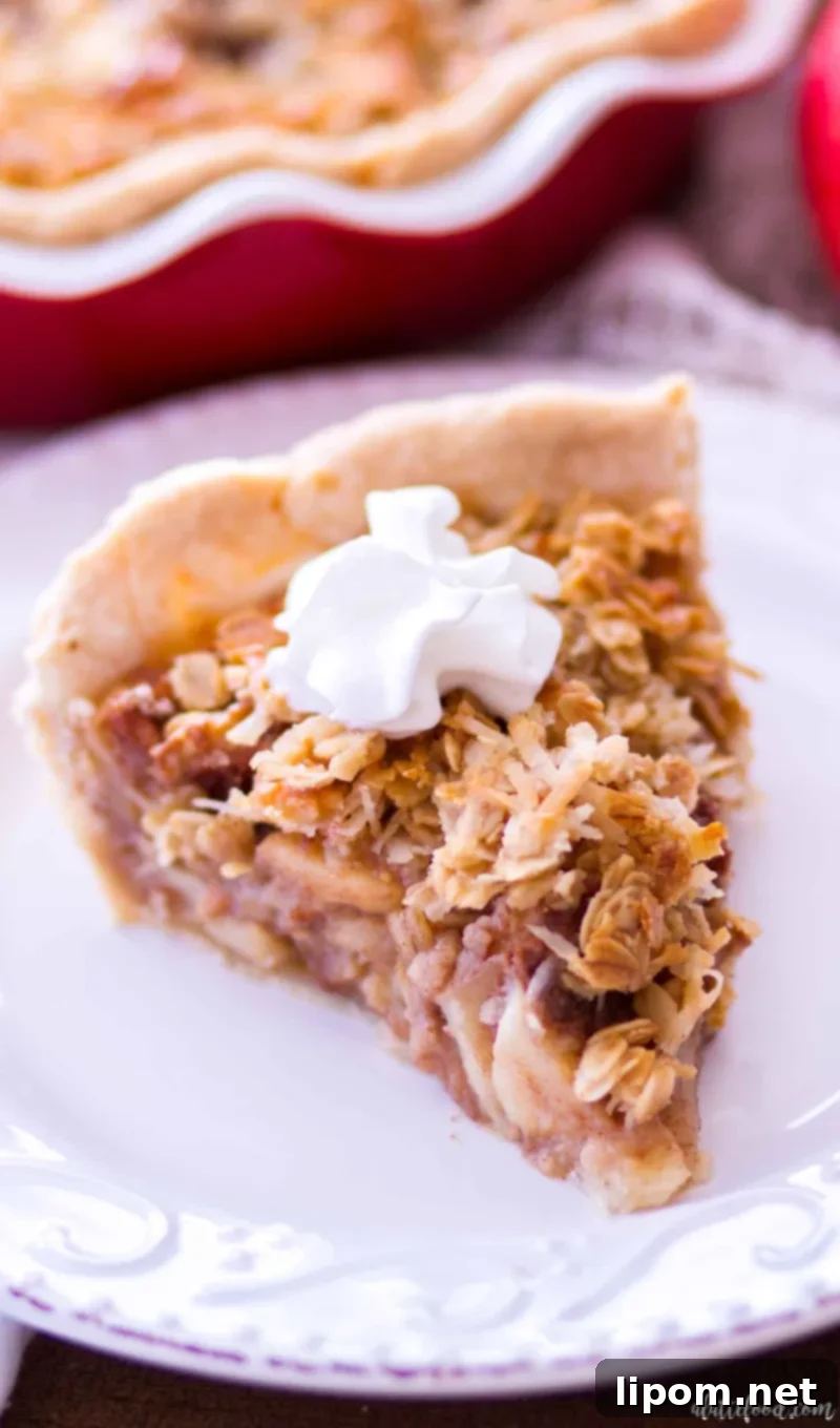 A freshly baked Maple Oatmeal Apple Pie, golden and bubbling, resting on a cooling rack