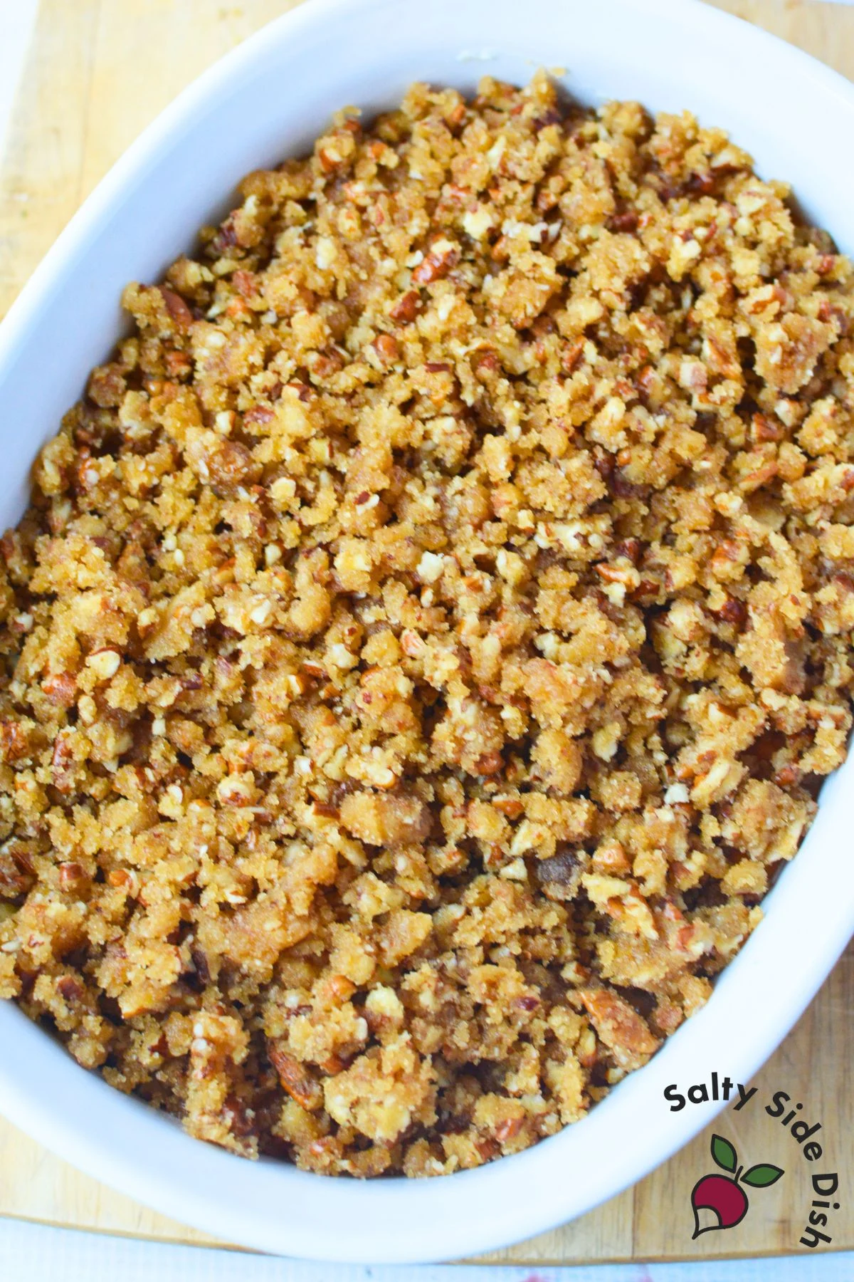 Close up of pecan topping mixture for Ruth’s Chris sweet potato casserole, brown sugar, pecans, flour, and melted butter mixed together.