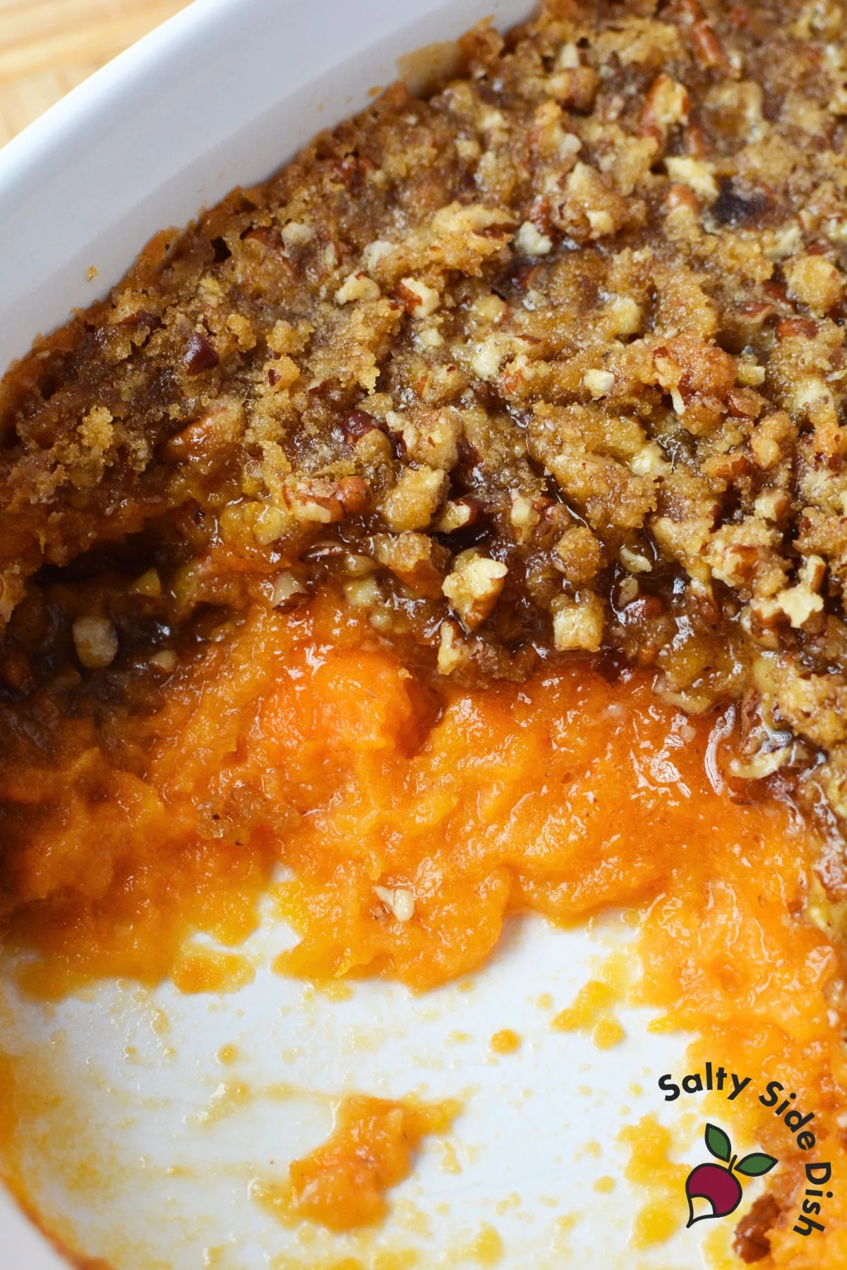 Ruth’s Chris sweet potato casserole baked in a white dish with golden brown pecan crust.