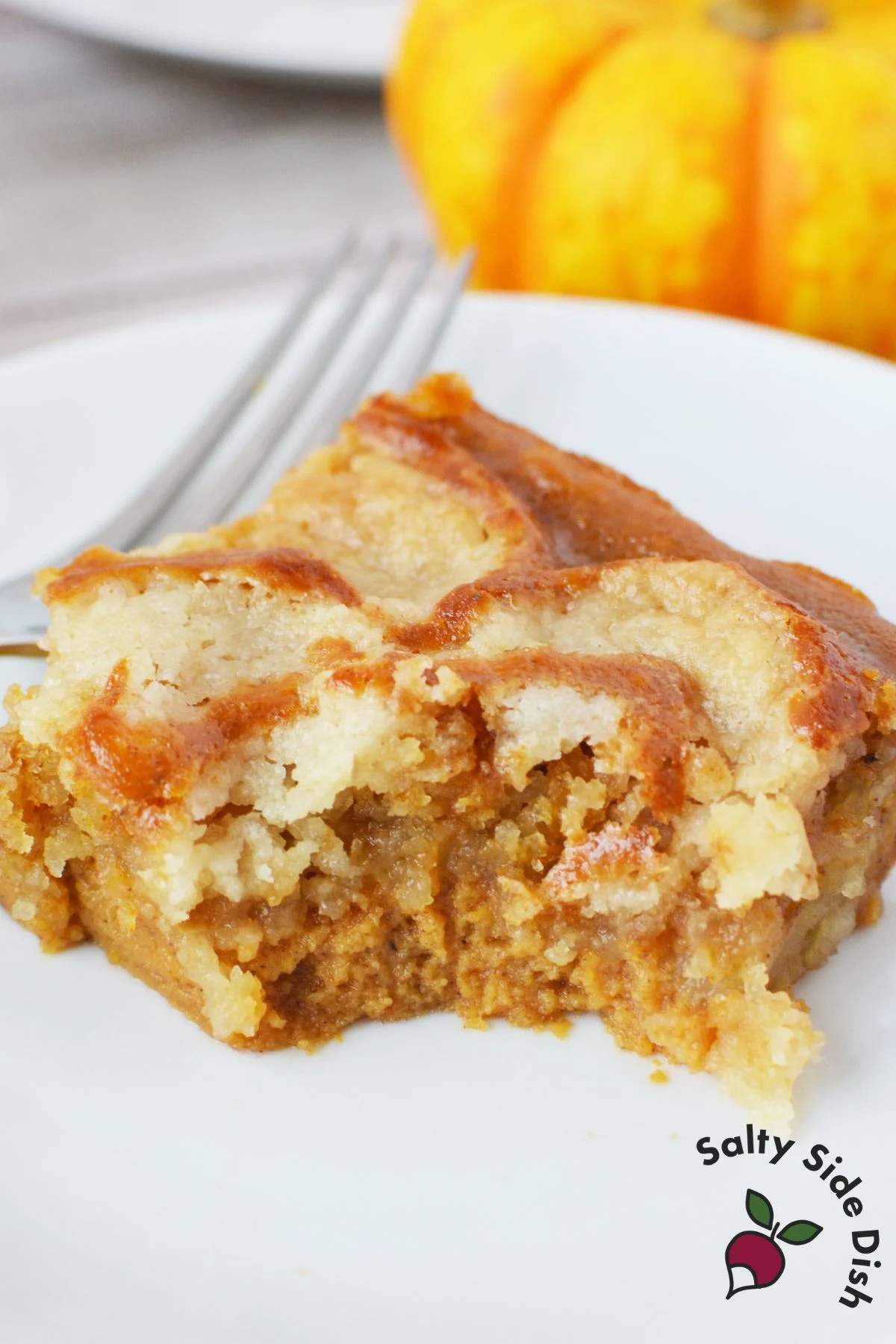 Overhead photo of easy fall dessert made with canned pumpkin and yellow cake mix in baking dish