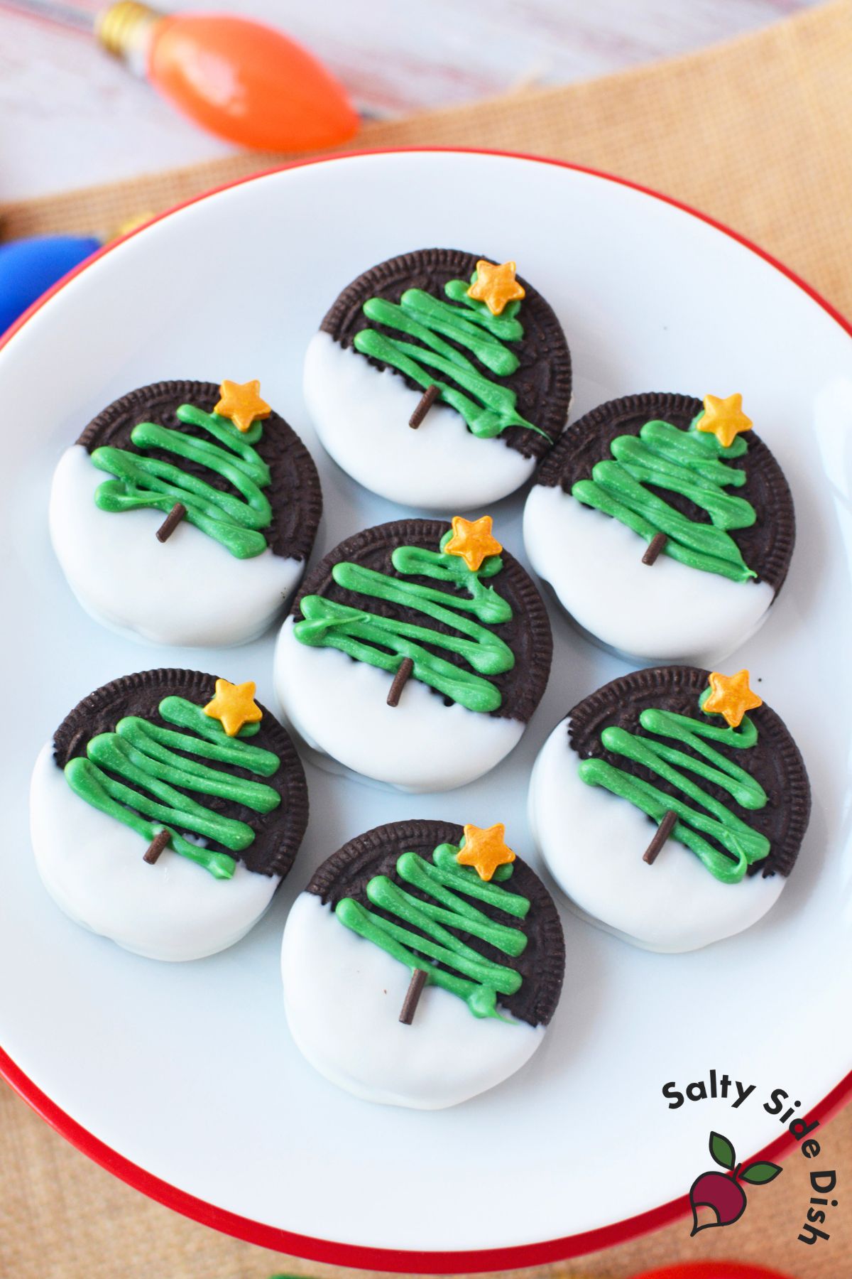 step by step process showing how to make chocolate covered christmas oreos with almond bark and candy melts