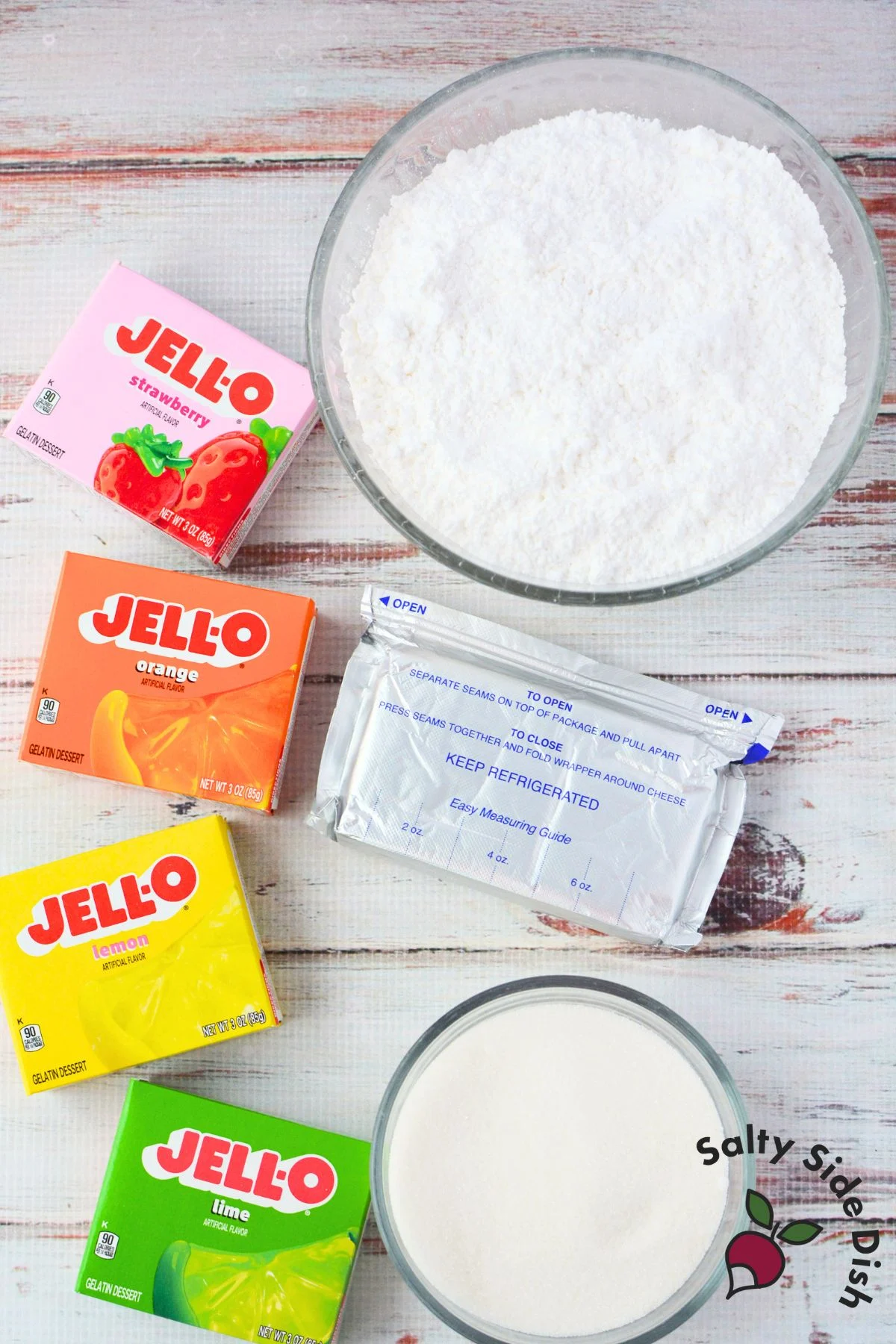 Ingredients for jello candy melts including cream cheese, powdered sugar, granulated sugar, and jello packets