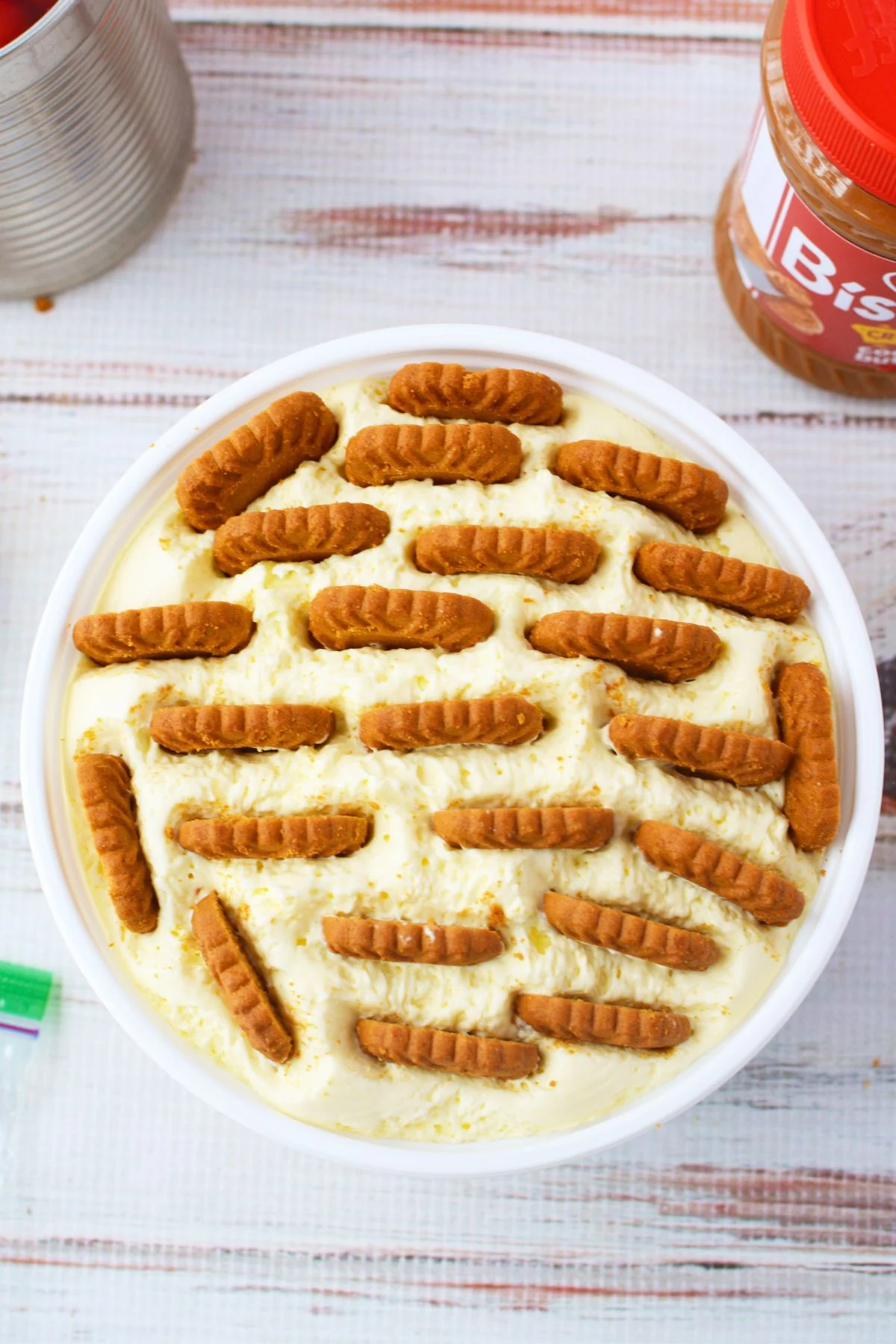 Close view of cherry and Biscoff cookie butter cheesecake slice with creamy texture
