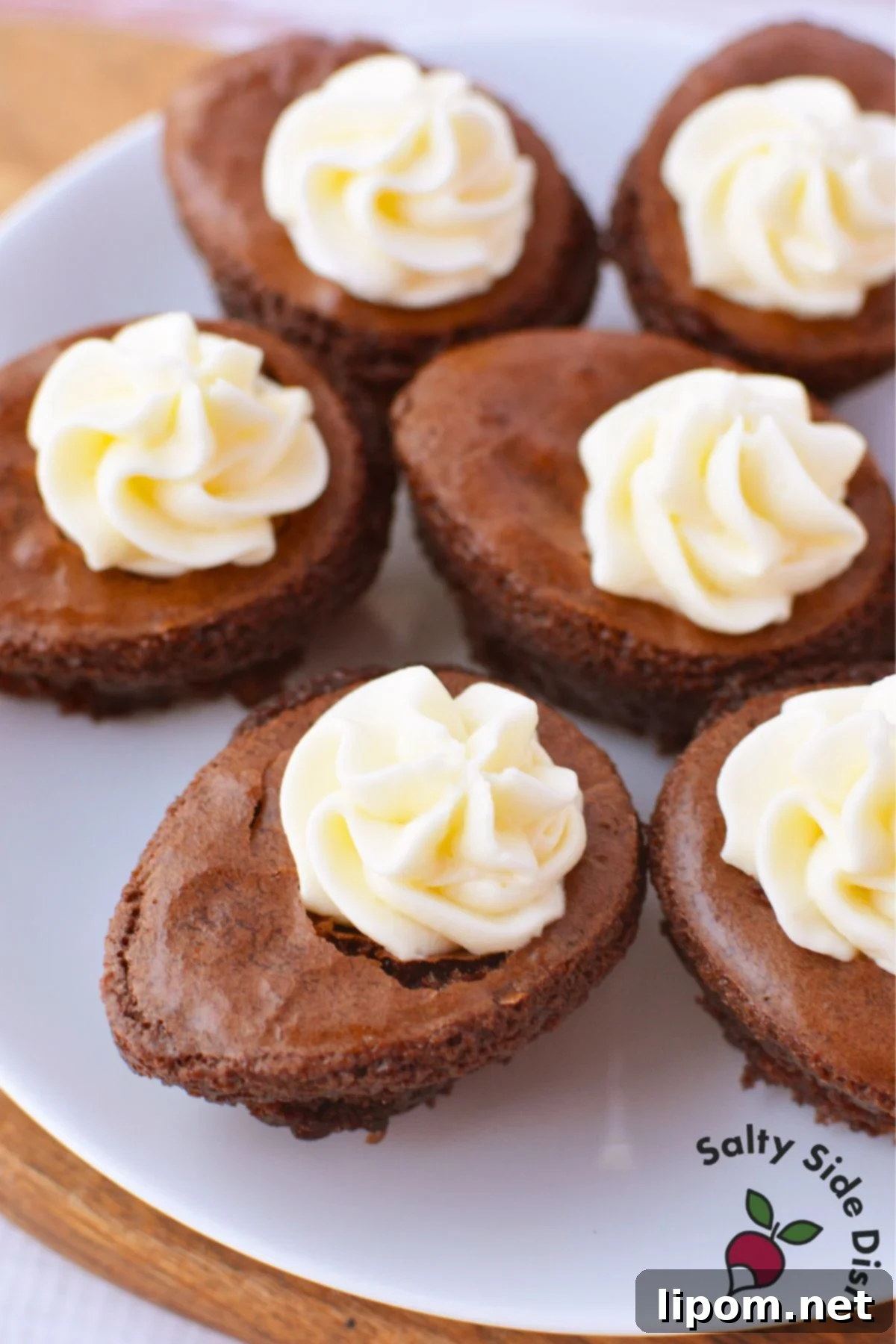 Plate of deviled brownies filled with cream cheese frosting and ready to serve