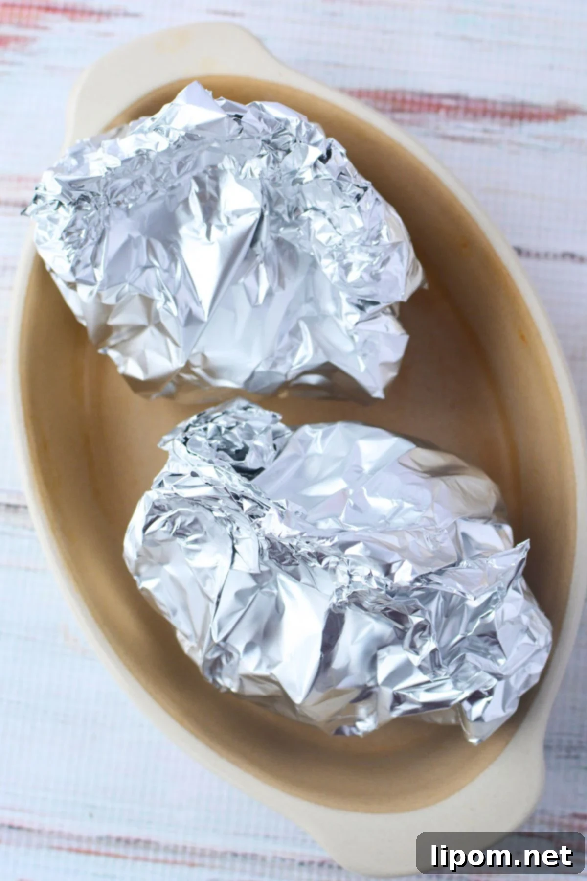 Viral TikTok Onion Simmer Sensation 7 Wrapped onions ready for the oven