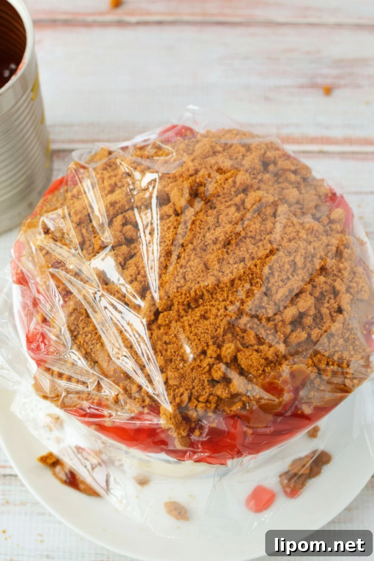 TikTok Japanese Cheesecake with Biscoff: A No-Bake Delight 8 No-bake cherry Biscoff cheesecake wrapped in plastic wrap for refrigerator storage