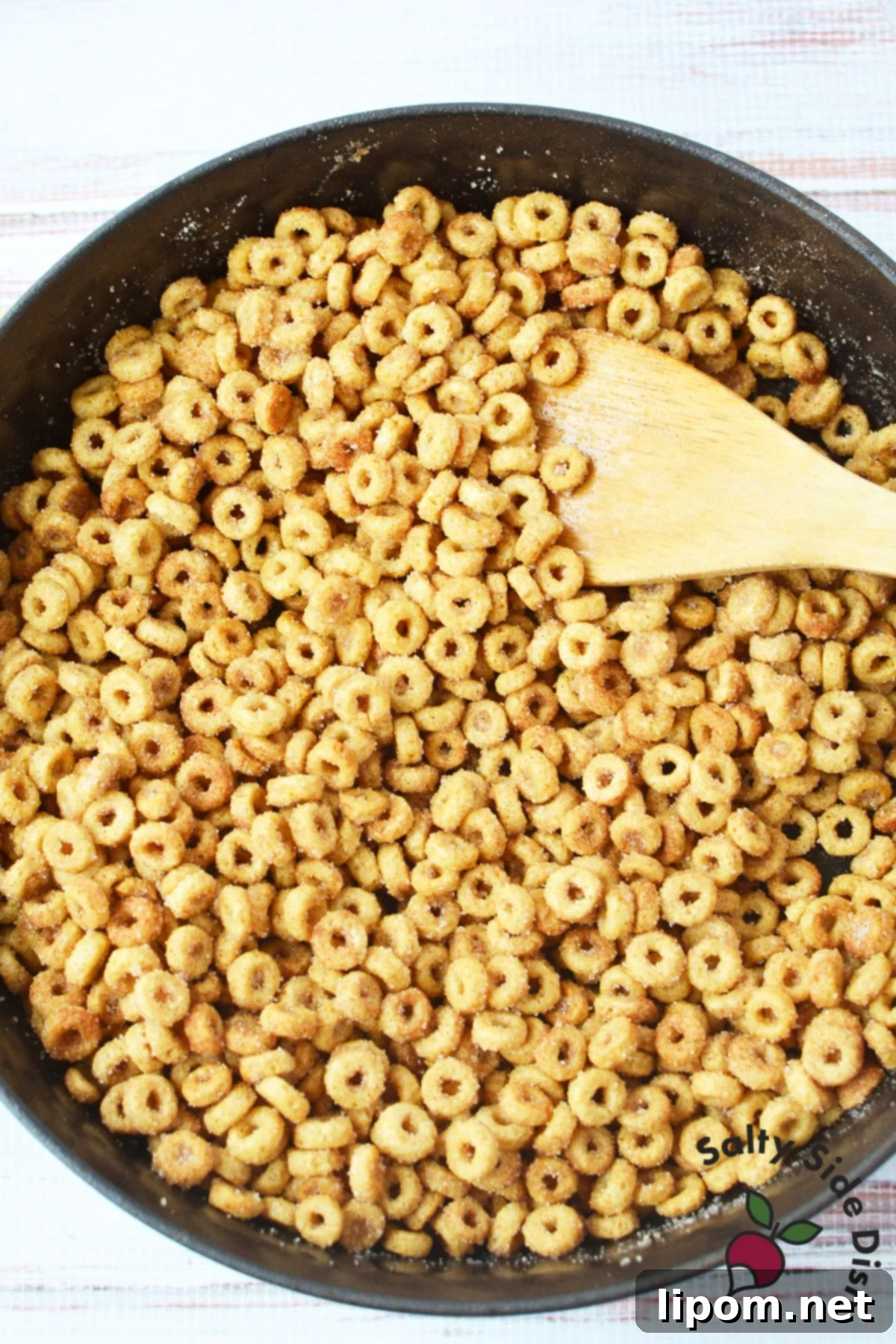 Pan-Fried Cinnamon Toast Cereal Bites 6 Close up of buttery cinnamon sugar Cheerios coated evenly after stovetop cooking
