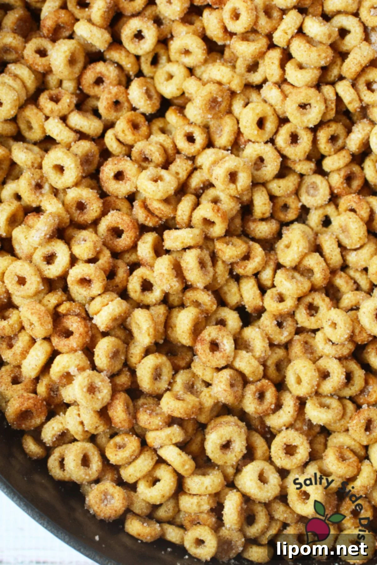Pan-Fried Cinnamon Toast Cereal Bites 8 Plain Cheerios cooking in butter in skillet for cinnamon sugar Cheerios recipe