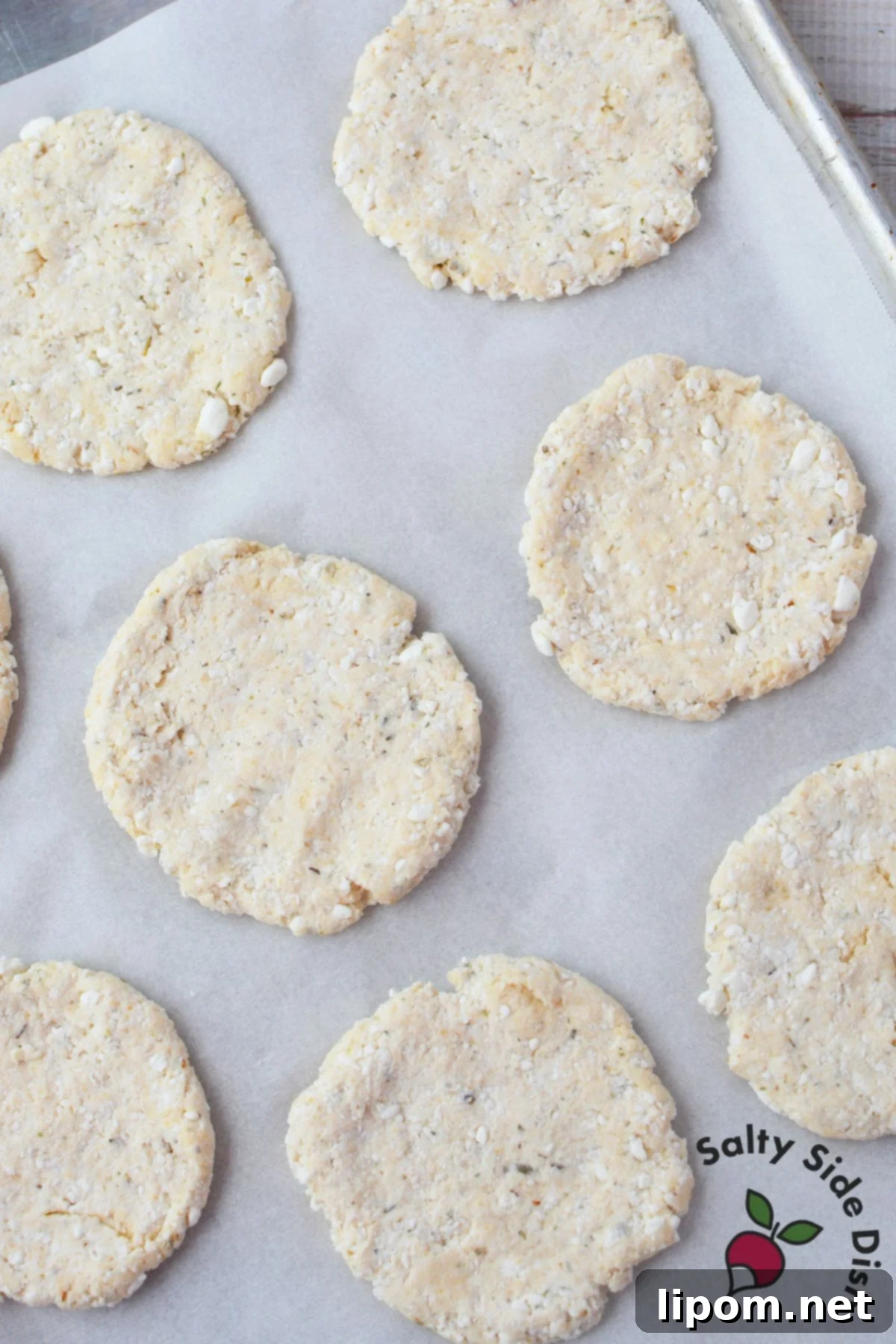 Cottage Cheese Pizza Bites 5 Unbaked cottage cheese pizza crusts on a baking sheet