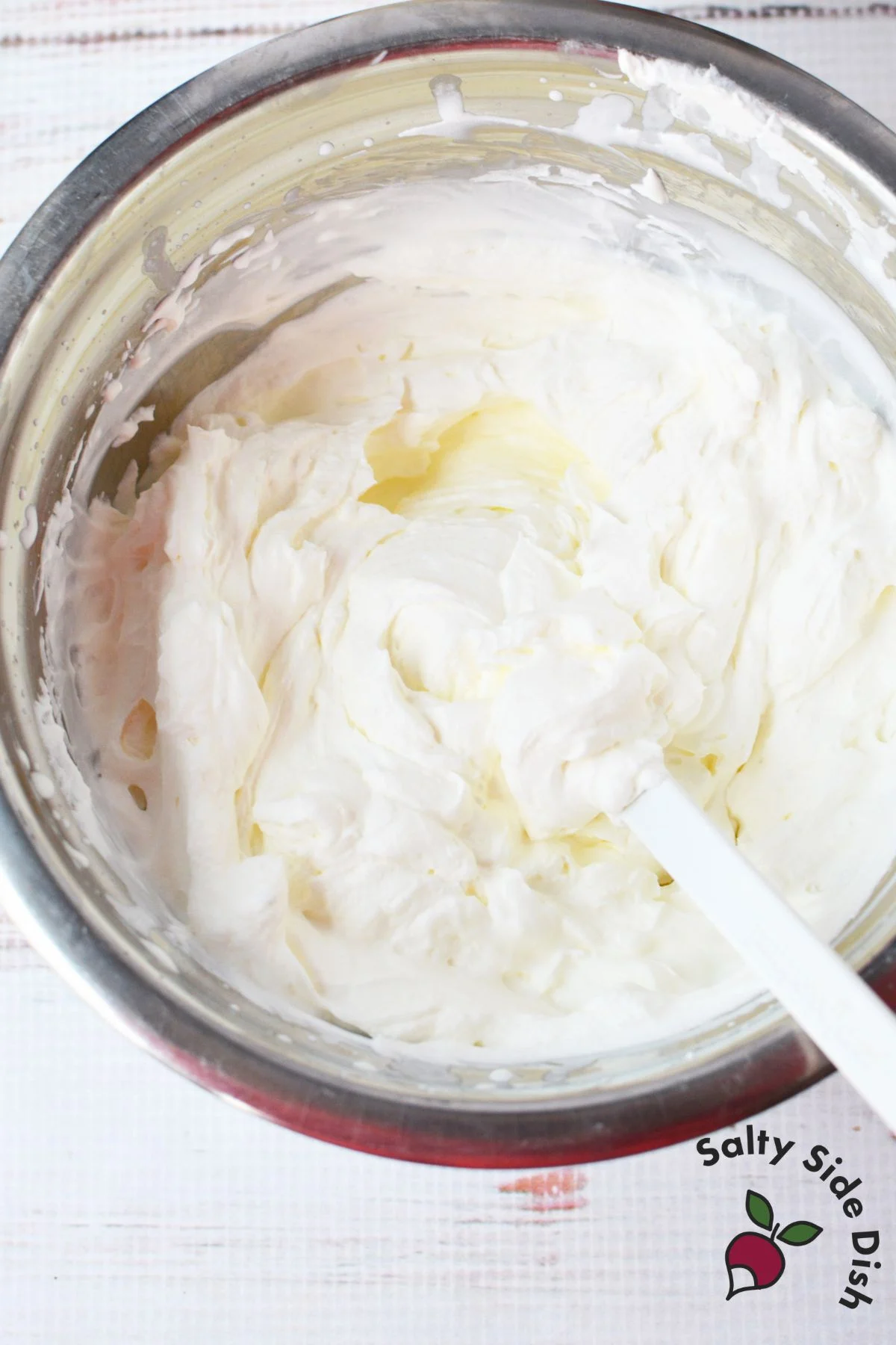 whipped cream mixture being prepared for grasshopper pie filling