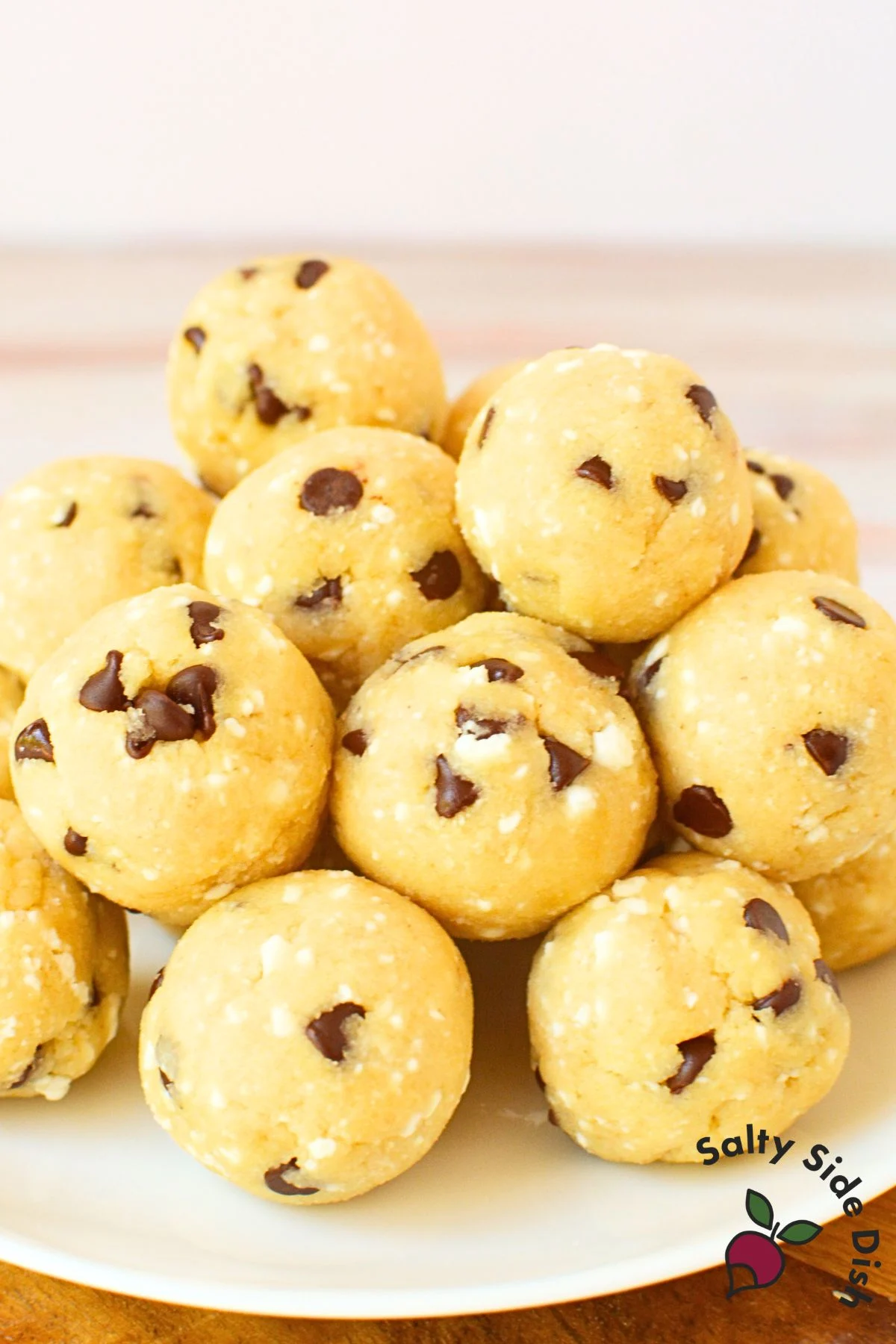 high protein cottage cheese cookie dough balls with chocolate chips on a white plate