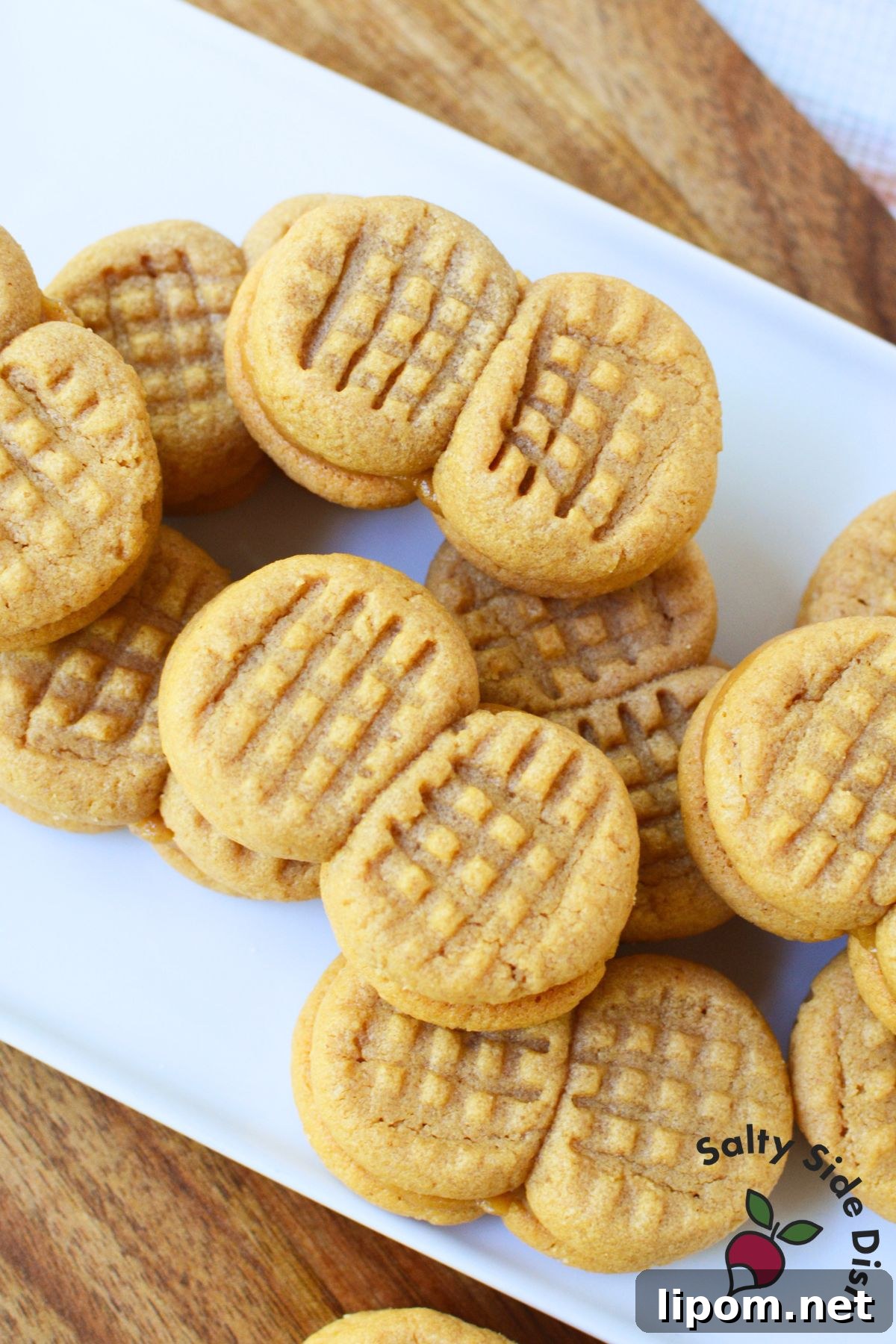 Copycat Nutter Butter Peanut Butter Cookies 7 A platter piled with homemade Nutter Butter sandwich cookies