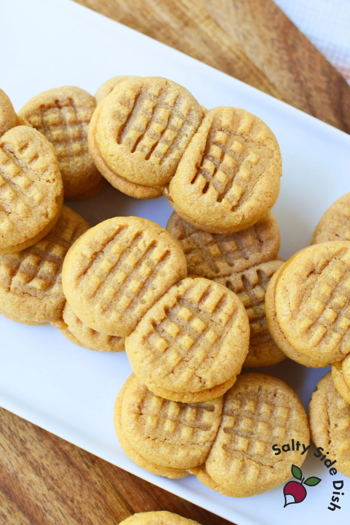 A platter piled with homemade Nutter Butter sandwich cookies