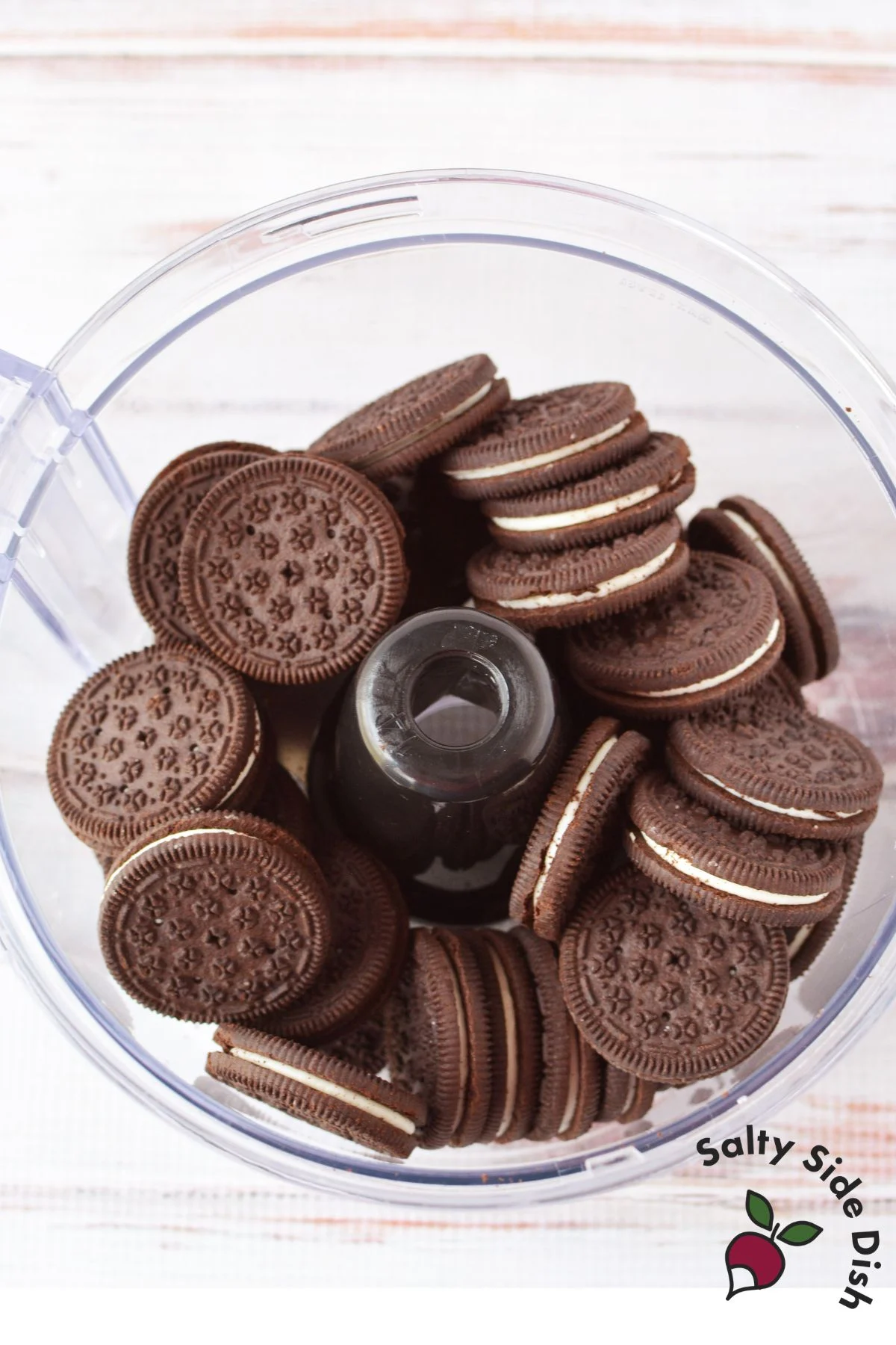 Oreo cookies in a food processor before being crushed into fine crumbs for Spring Oreo Truffles.