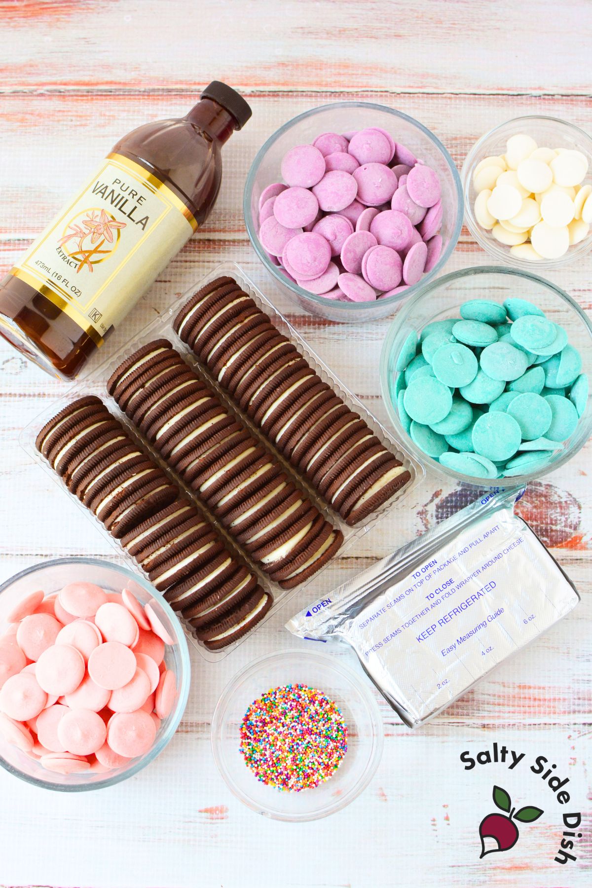 Ingredients needed to make Spring Oreo Truffles including Oreos, cream cheese, pastel candy melts, vanilla, and rainbow sprinkles.