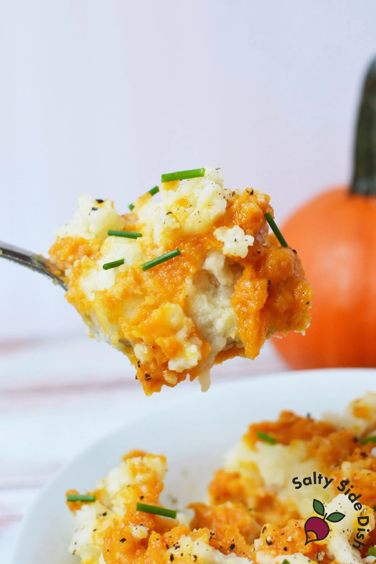Pumpkin mashed potatoes with savory pumpkin puree, chives, and black pepper