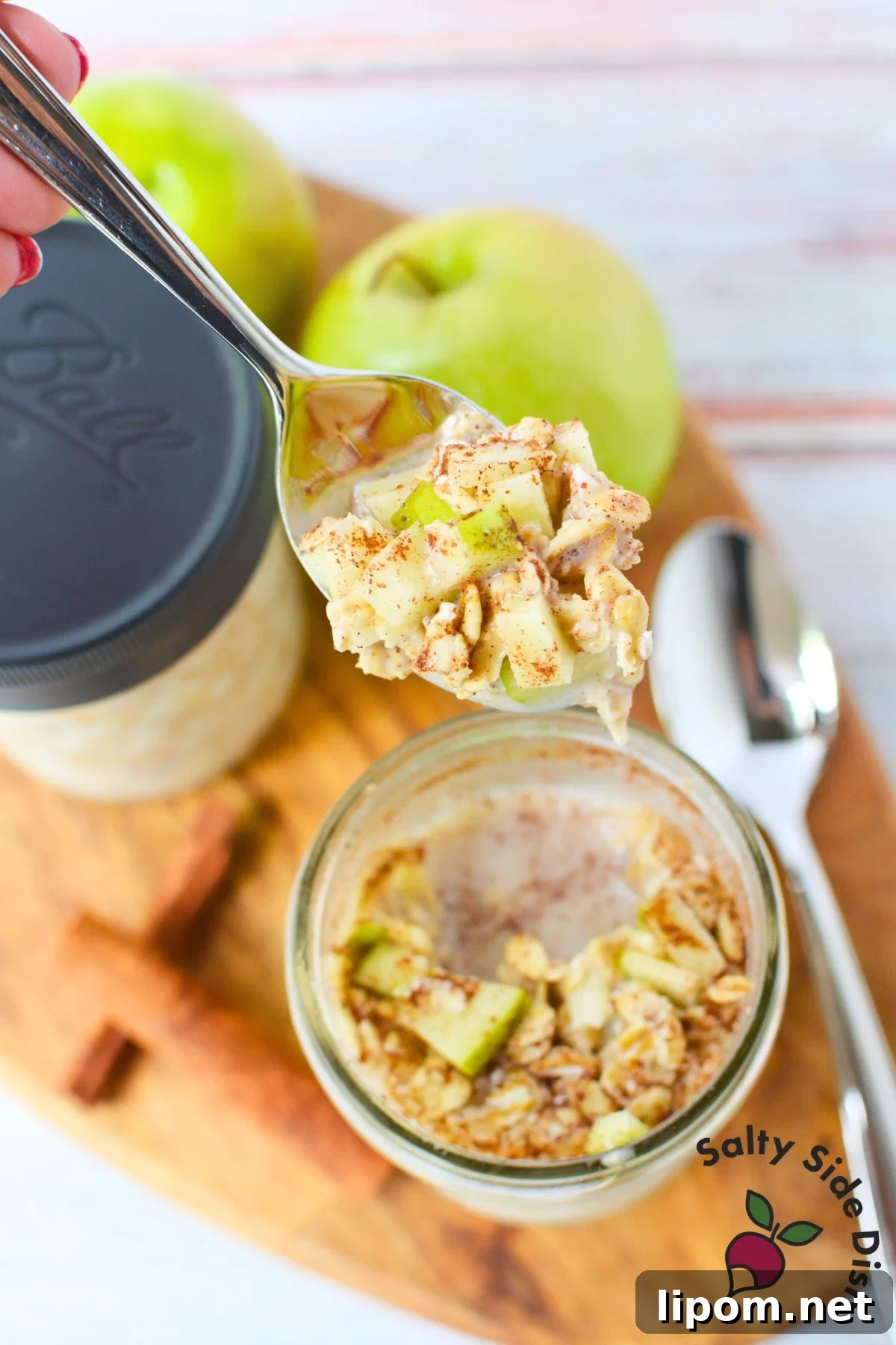 Overnight Oats Recipes: 4 Flavor Variations to Prep Ahead 5 Spoonful of apple cinnamon overnight oats with diced green apple and cinnamon above a mason jar.